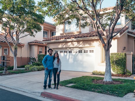 happy family in front of their house