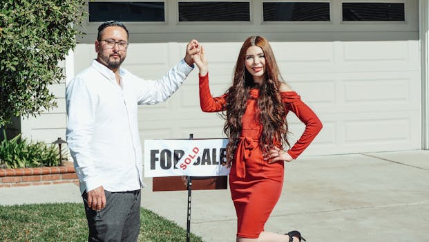 happy family in front of their new home