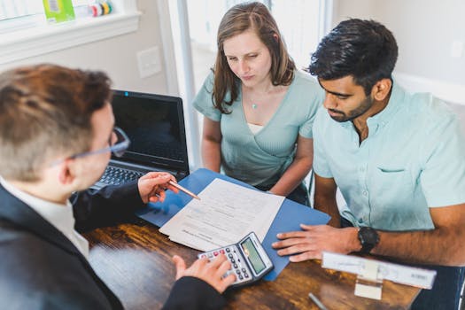 image of a calculator and mortgage documents