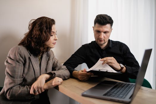 a couple reviewing their mortgage documents