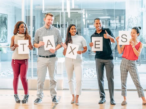 person holding tax forms