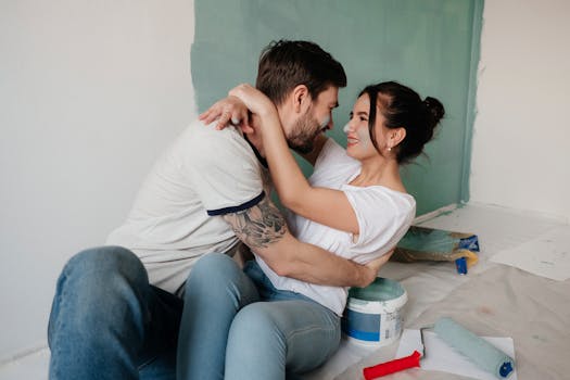 happy young couple looking at houses