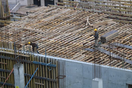 construction site with workers and materials