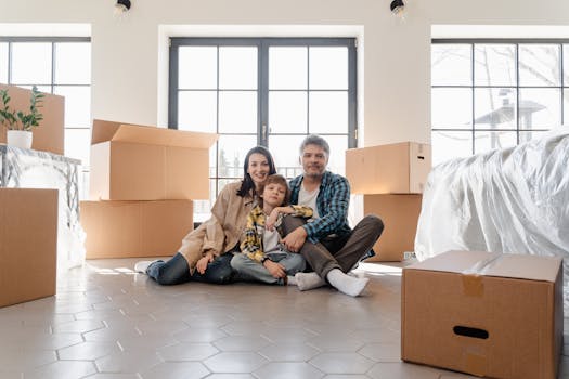 a happy family outside their new home