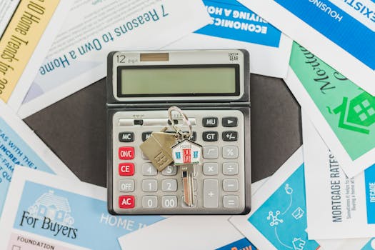 a calculator and mortgage documents